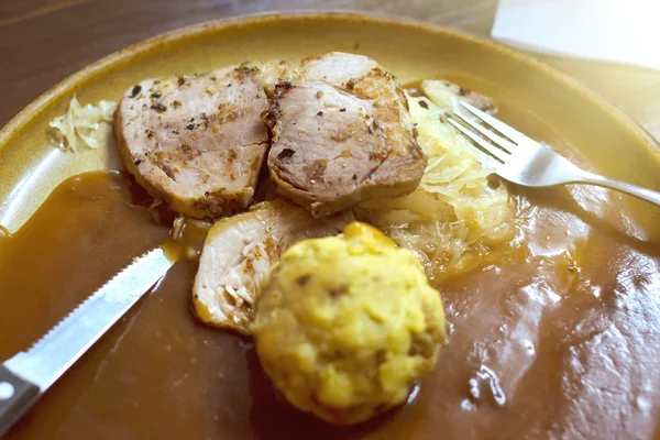 Appetizing meat dish national Czech cuisine is on the table at a local restaurant. Vytopna