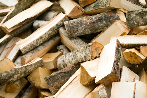 Background of wooden cut firewood — Stock Photo, Image