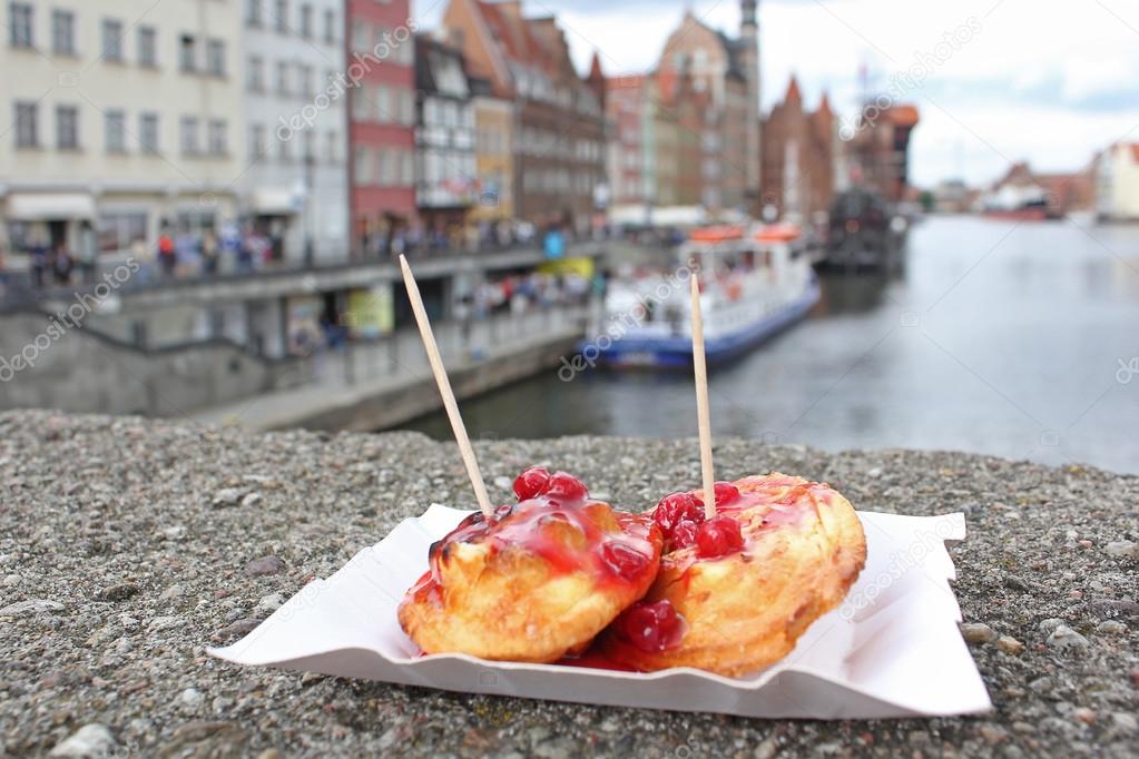 Sheep fried cheese with cranberry sauce. Street food on the embankment in Gdansk. 