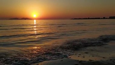 Sunset at the seaside. Sunny summer evening in Vlora, Albania. Sazan Island. 