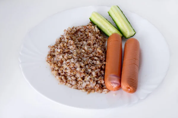 Buckwheat Sausages Cucumbers White Plate White Background Imagen de stock