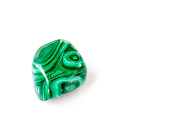 Polished malachite stone on white background Stock Image