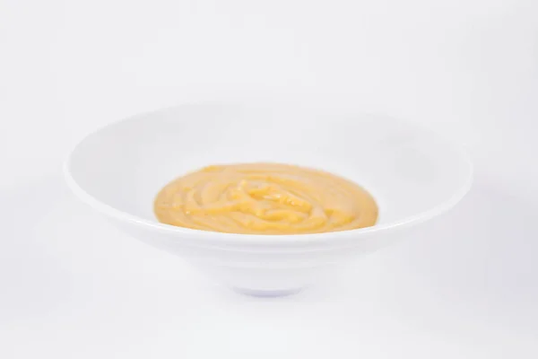 Kürbissuppe Auf Einem Teller Auf Weißem Hintergrund — Stockfoto