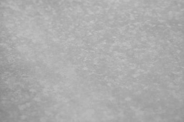 Kar yüzeyi yakın mesafede. Taze beyaz kar dokusu. Kış arkaplanı.