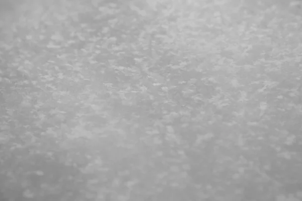 Snow surface in close up. Fresh white snow texture. Winter background.