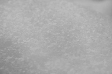 Kar yüzeyi yakın mesafede. Taze beyaz kar dokusu. Kış arkaplanı.