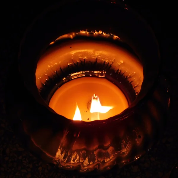 Votive candle burning