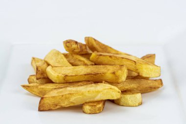 Authentic French fries potatoes isolated on white background