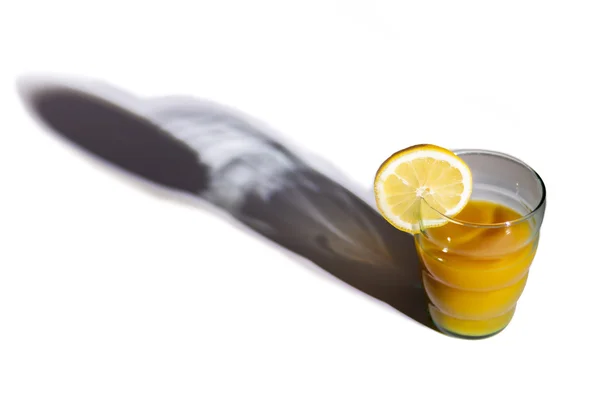 Fresh orange juice with lemon on white. — Stock Photo, Image