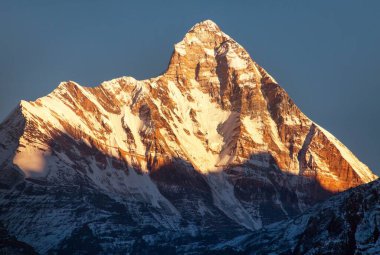 Panoramic view of mount Nanda Devi, one of the best mounts in Indian Himalaya, seen from Joshimath Auli,  Uttarakhand, India, evening sunset view clipart
