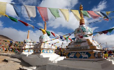 Prayer flags with stupas - Kunzum La pass - Himachal Pradesh - India  clipart