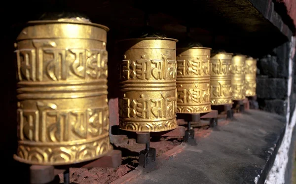 Golden buddhist prayer wheels — Stock Photo, Image