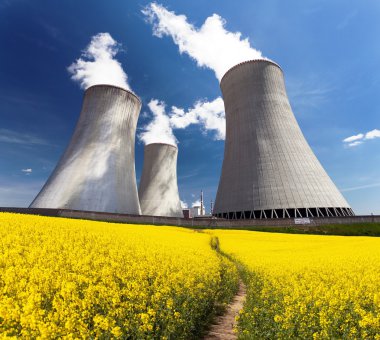 Nuclear power plant Dukovany with golden flowering field clipart
