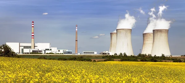 Nuclear power plant Dukovany with golden glowering field — Stock Fotó