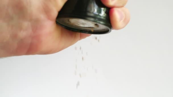 Man Hairy Hand Holds Pepper Mill White Background Ground Pepper — Stock Video