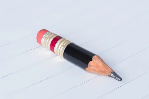 Black pencil with pink eraser on a paper — Stock Photo, Image