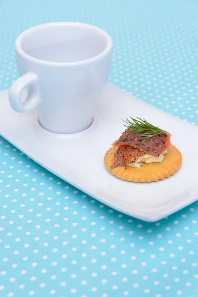 Salmon cream cheese biscuit on blue vintage background — Stock Photo, Image