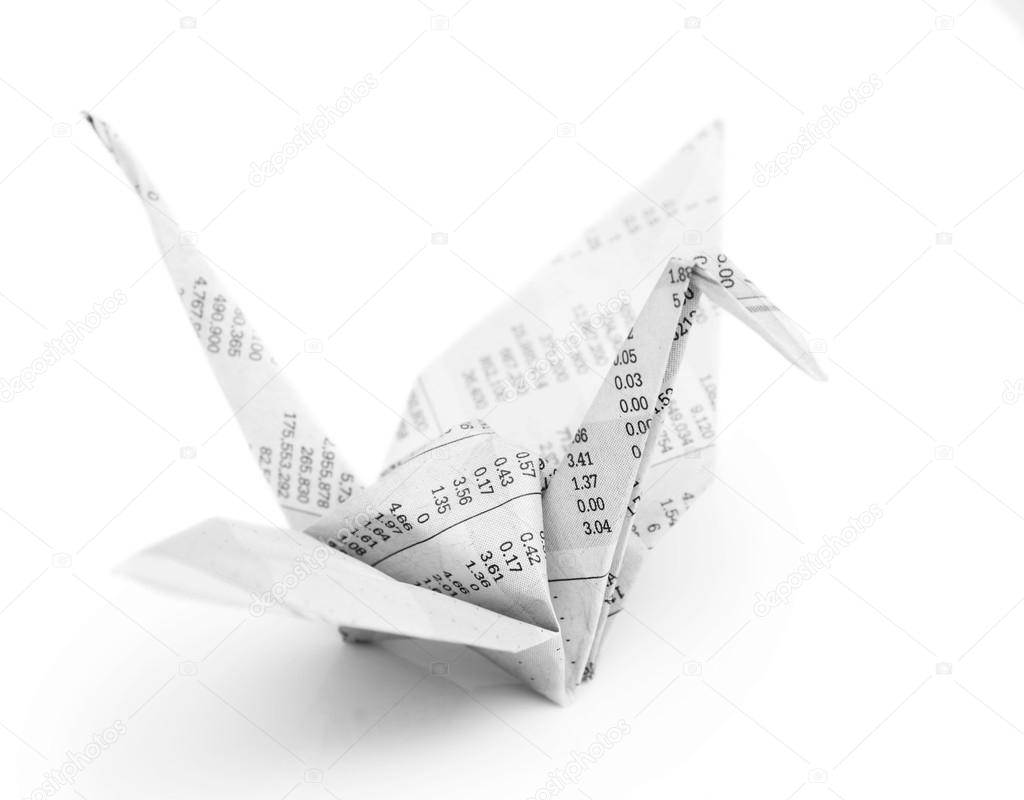 Origami crane bird from recycle newspaper on white background