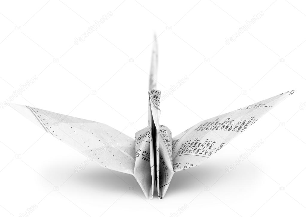 Origami crane bird from recycle newspaper on white background