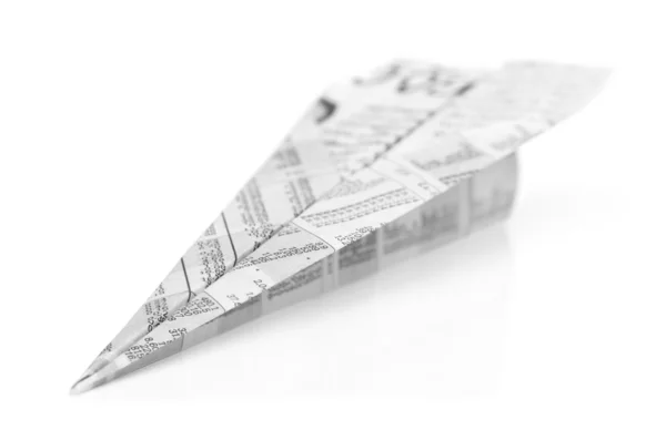 Origami avião de jornal isolado no fundo branco — Fotografia de Stock