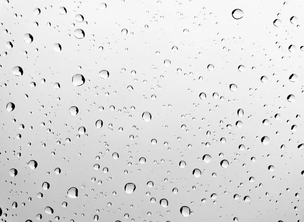 Gotas de lluvia en la ventana de cristal del coche —  Fotos de Stock