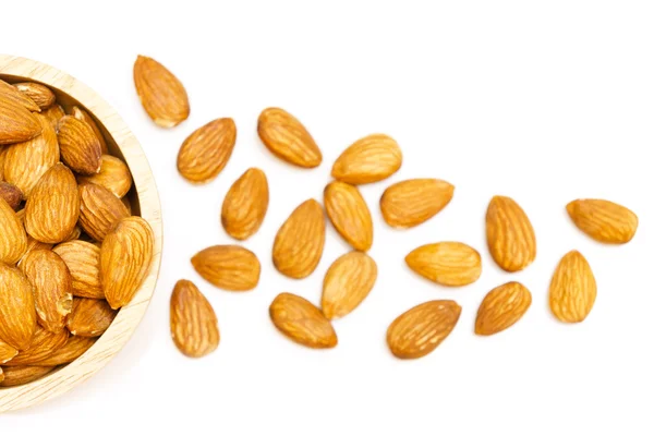 Almond snack in wooden bowl isolated on white background — Stock Photo, Image