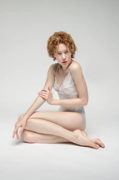 Girl in white bodysuit — Stock Photo, Image