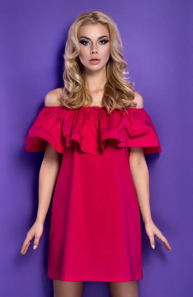 Blonde girl in red dress — Stock Photo, Image