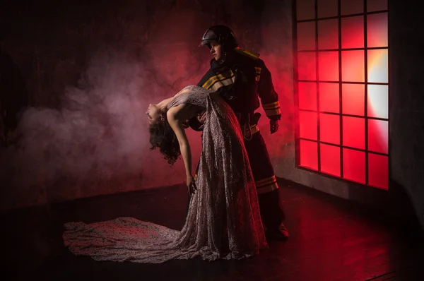 A Firefighter with beautiful woman — Stock Photo, Image