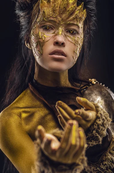 Woman in golden fantasy armour — Stock Photo, Image