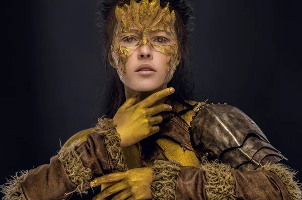 Woman in golden fantasy armour — Stock Photo, Image