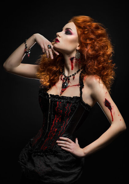Redhead woman with wounds
