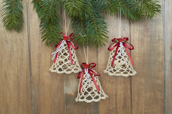 Christmas bells on wooden background — Stock Photo, Image