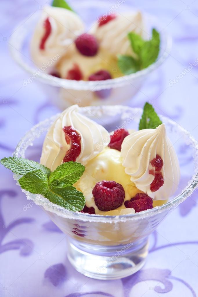 Dessert with pineapple ice cream, raspberries and meringue — Stock Photo © MarinaN 53102191