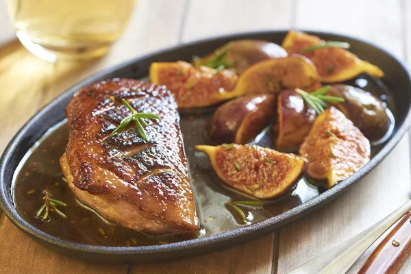 Roasted duck breast with figs and rosemary Stock Picture