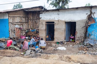 Magsegnit, Amhara Region, Ethiopia - April 22, 2019: Ethiopian mans resting behind house in city Magsegnit, Ethiopia, Africa
