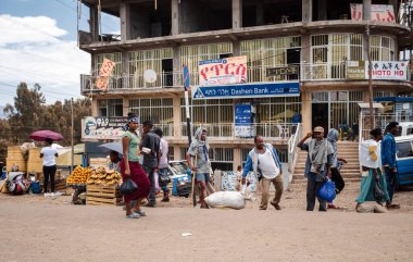 Azezo, Amhara Region, Ethiopia - April 22, 2019: Ordinary peoples behind african Dashen bank, every person in Ethiopia has bank account. City Azezo, Ethiopia, Africa