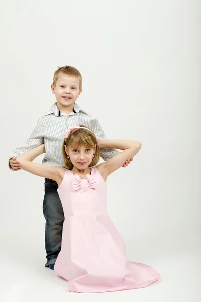 Studio portrait of siblings beautiful boy and girl — Stock Photo, Image