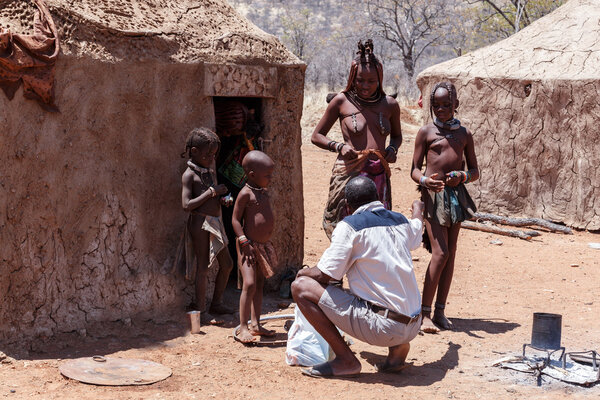 Himba woman with childs in the village