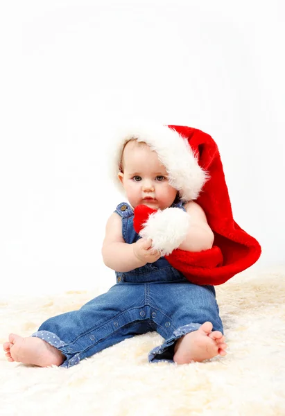 Child girl with Christmas santa hat — Stock Photo, Image