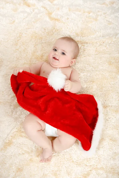 크리스마스 산타 모자와 함께 여 자가 자식 — 스톡 사진
