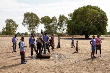 Happy Namibian school children waiting for a lesson. clipart