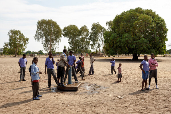 Happy Namibian school children waiting for a lesson.