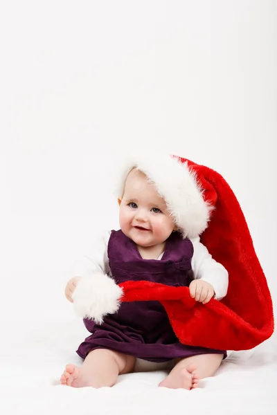 Child girl with Christmas santa hat — Stock Photo, Image