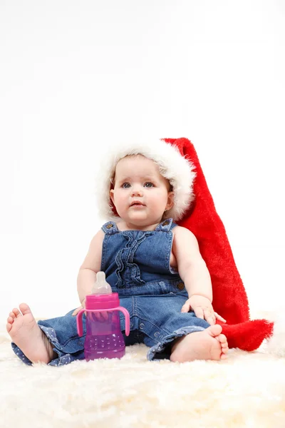 Child girl with Christmas santa hat — Stock Photo, Image