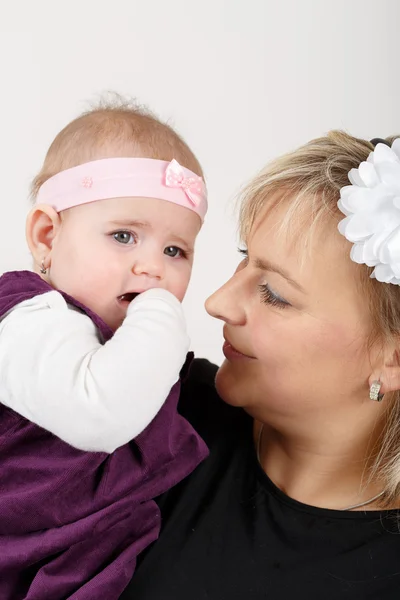Loving mother embracing her baby girl — Stock Photo, Image