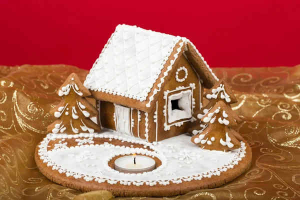 Holiday Gingerbread house on red. — Stock Photo, Image