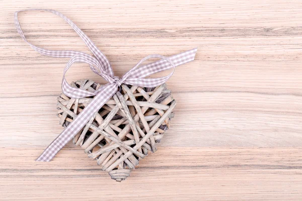 Valentine's wooden hearts on a wooden background in retro color — Stock Photo, Image