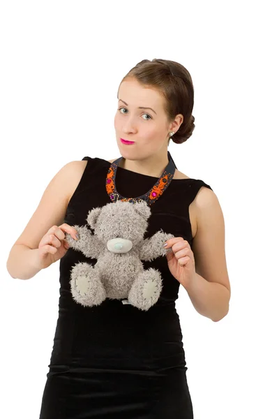 Attractive smiling brunette holding teddy bear — Stock Photo, Image