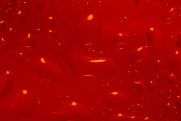 Fond abstrait rouge avec des gouttes d'eau — Photo